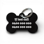 Black bone-shaped aluminium dog tag with dogs name  and phone number engraved.