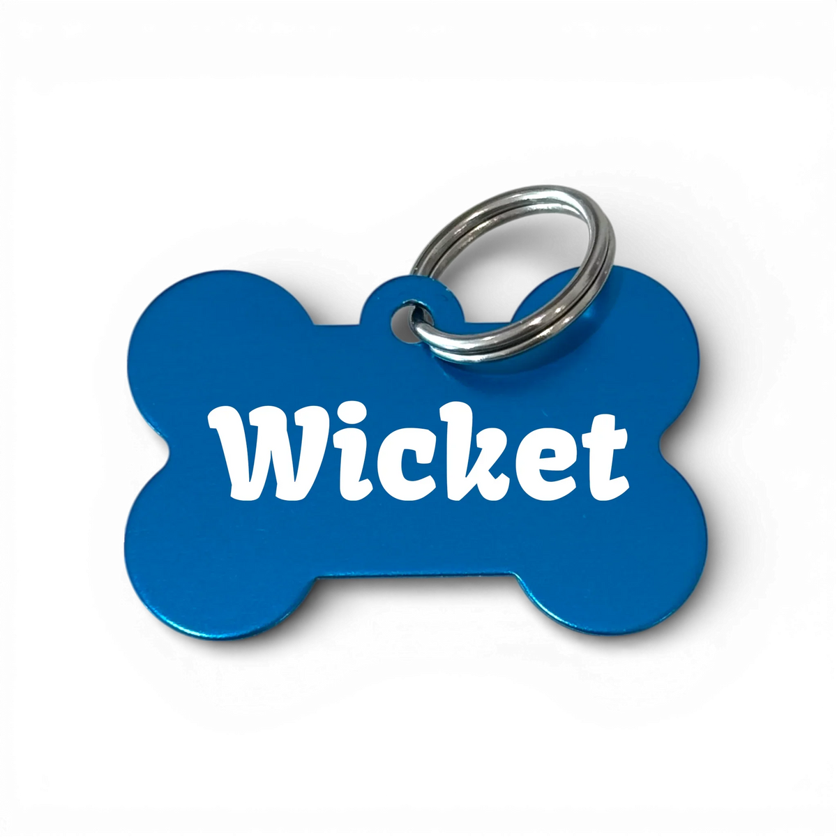 Blue bone-shaped aluminium dog tag with dogs name and phone number engraved. 