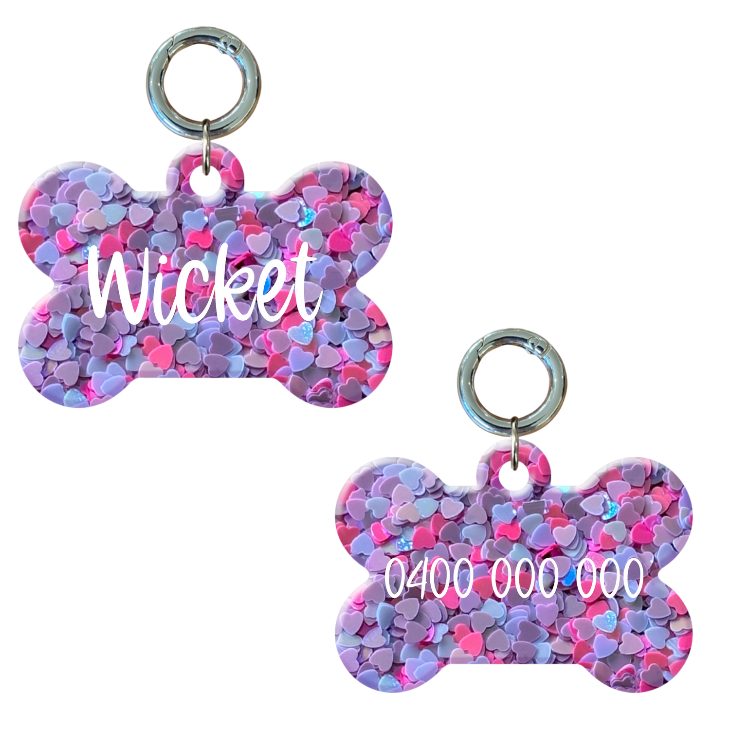 Personalised bone-shaped dog tag with pink and purple heart pattern, includes name and number. 