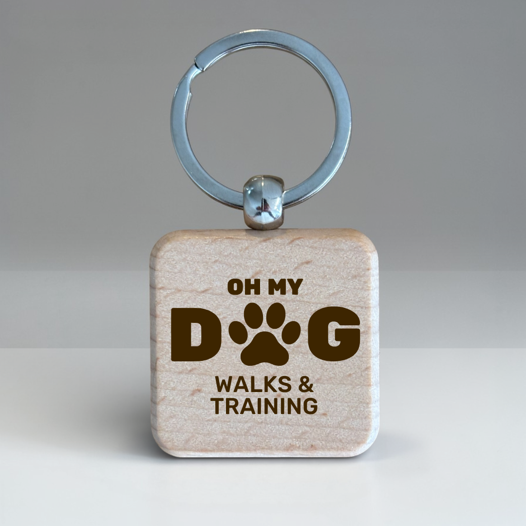 Engraved square wooden keyring with the 'Oh My Dog Walks & Training' logo.