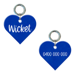 Fluro blue heart-shaped custom dog tag with engraved name and phone number