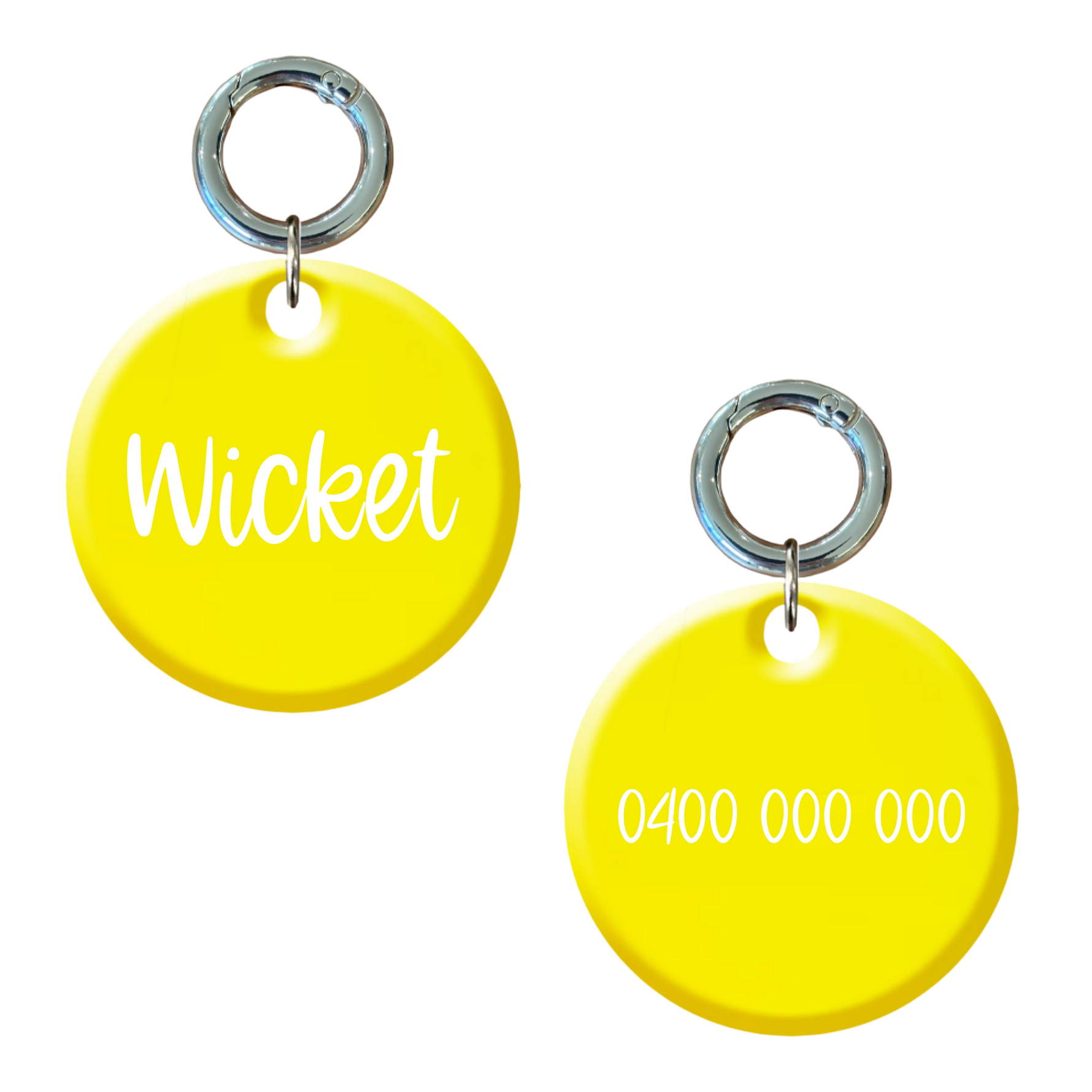 Bright yellow round personalised dog tag with metal ring, custom name and phone number shown.