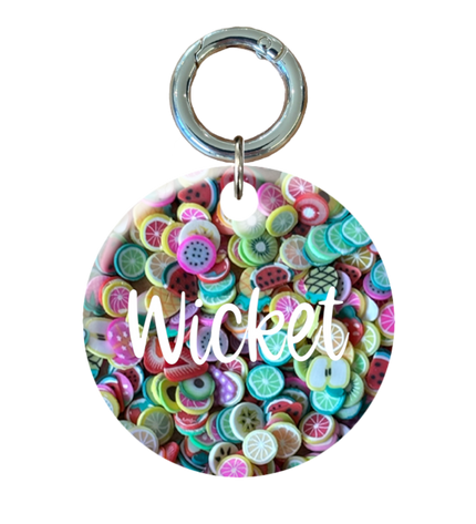 Colorful circular Pet ID tag with white text