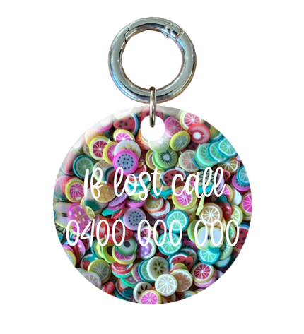 Fruit filled circle tag with contact information on he back.