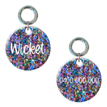 Round glittery dog tag with multicolored crystals, custom engraved with name and phone number.