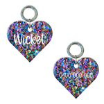 Personalised heart-shaped dog tag filled with glitter, includes name and number. 