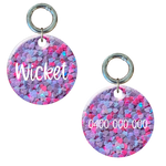 Round dog tag with pink and purple heart pattern, personalized name and phone number.