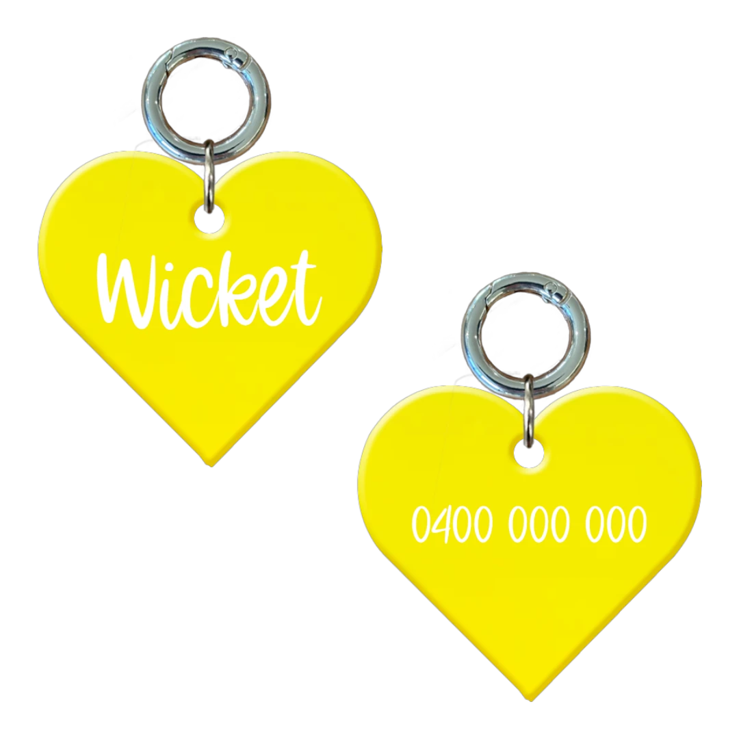Yellow heart-shaped personalised dog tag with name and phone number engraving